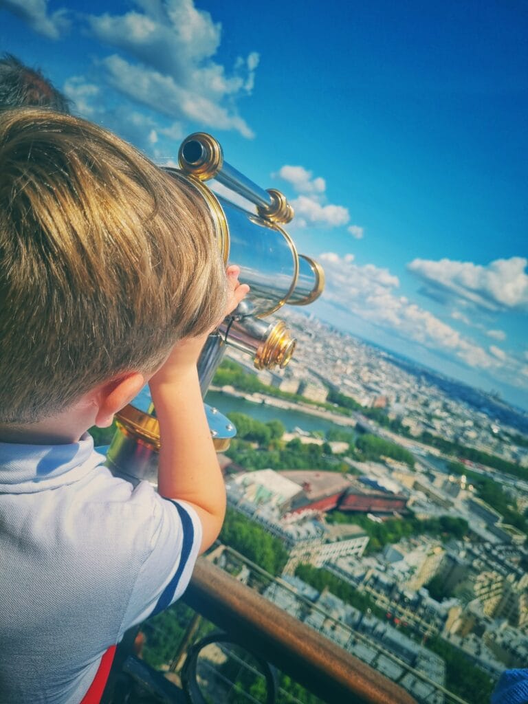 young boy up the Eiffel Tower